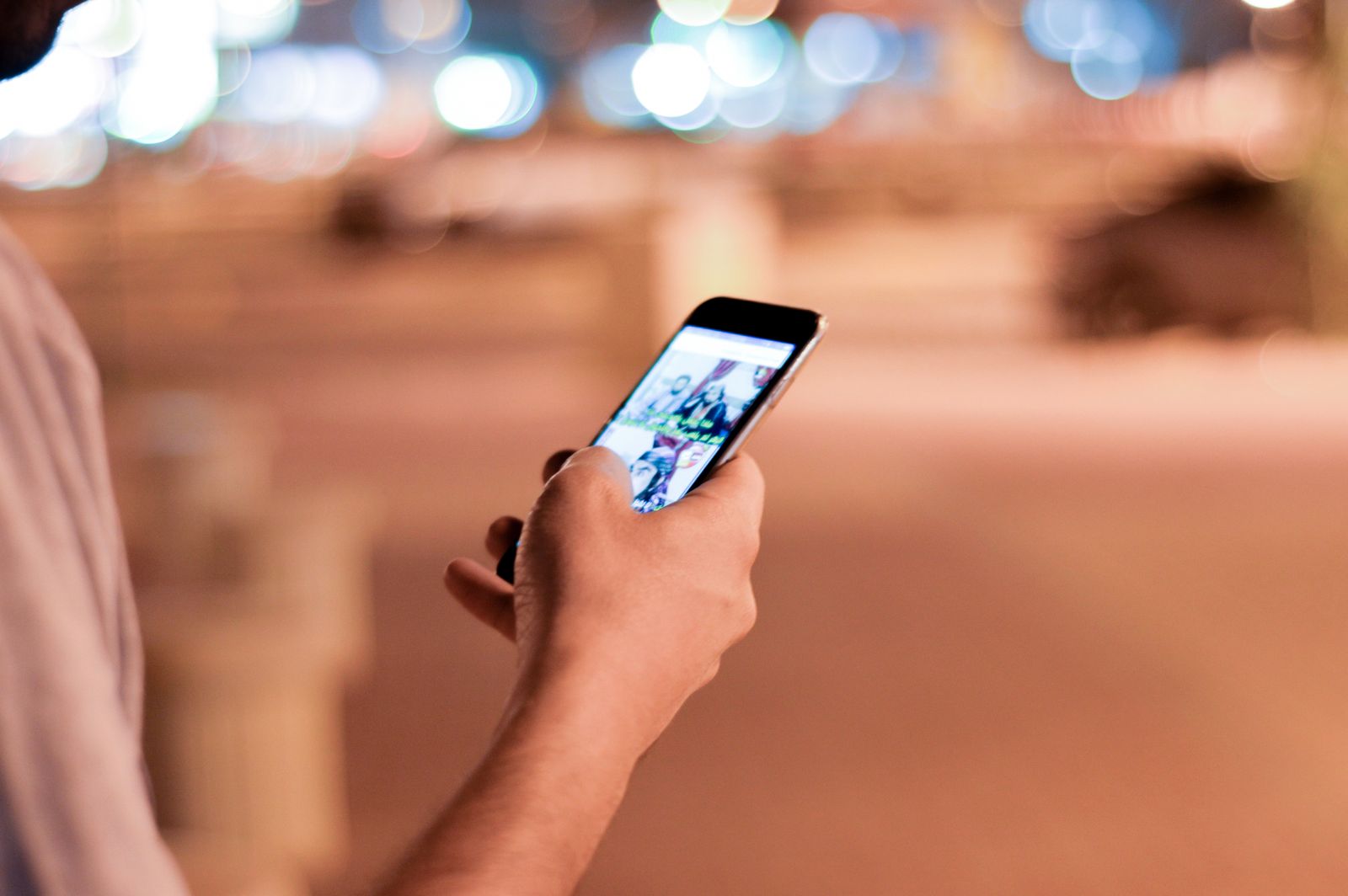 Person scrolling through photos on a smartphone