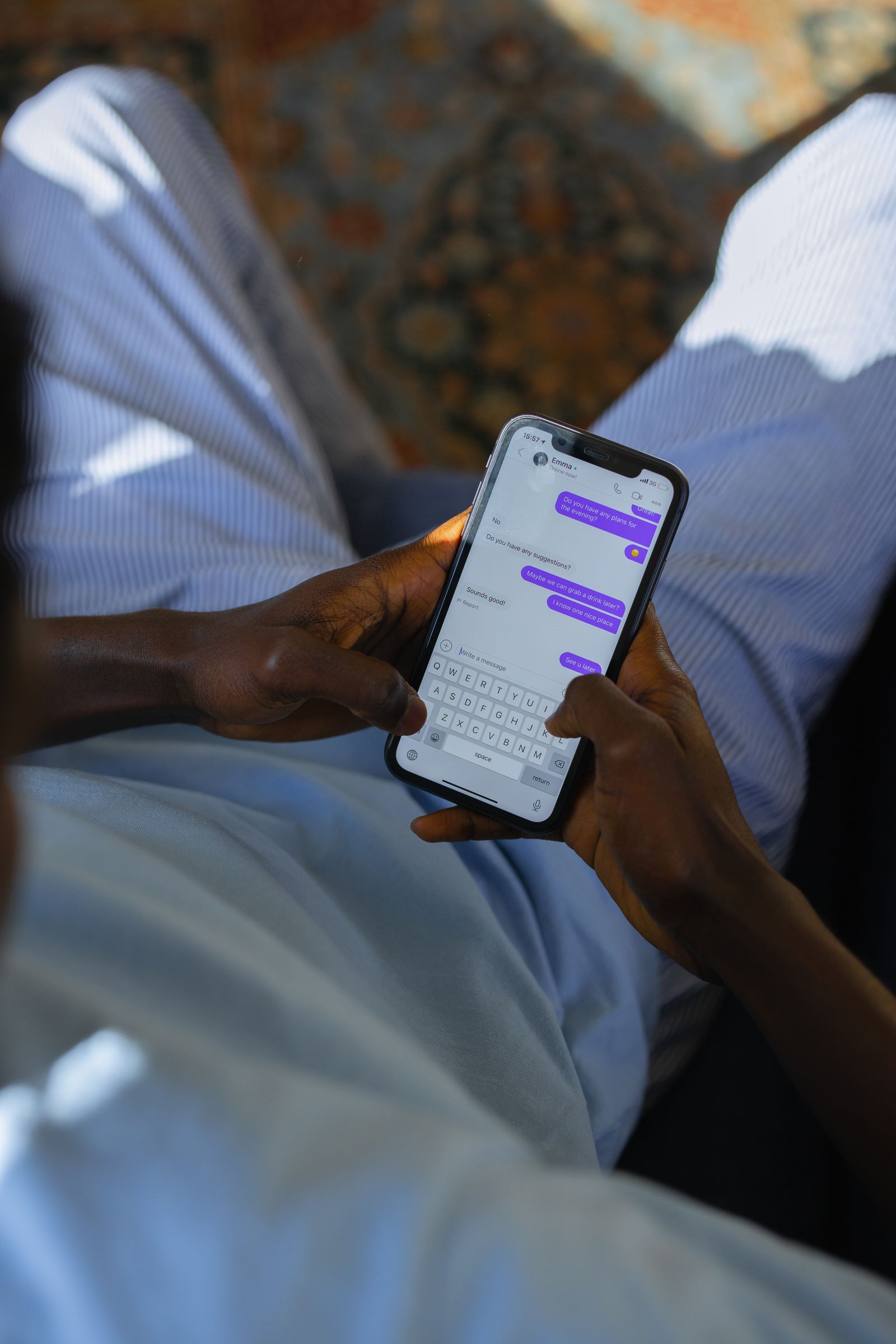 Person typing a message on a phone