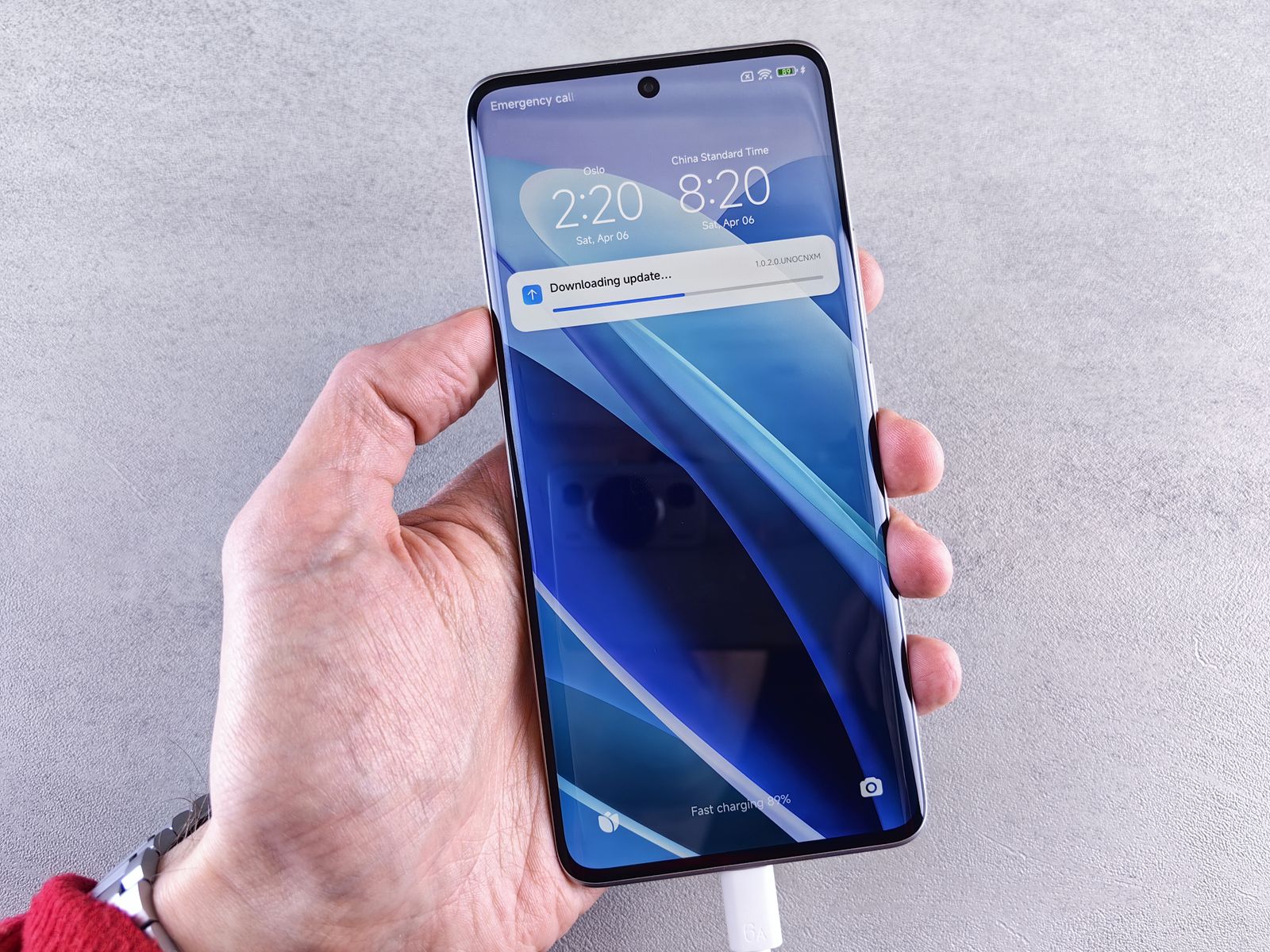 Hand holding a phone showing a notification