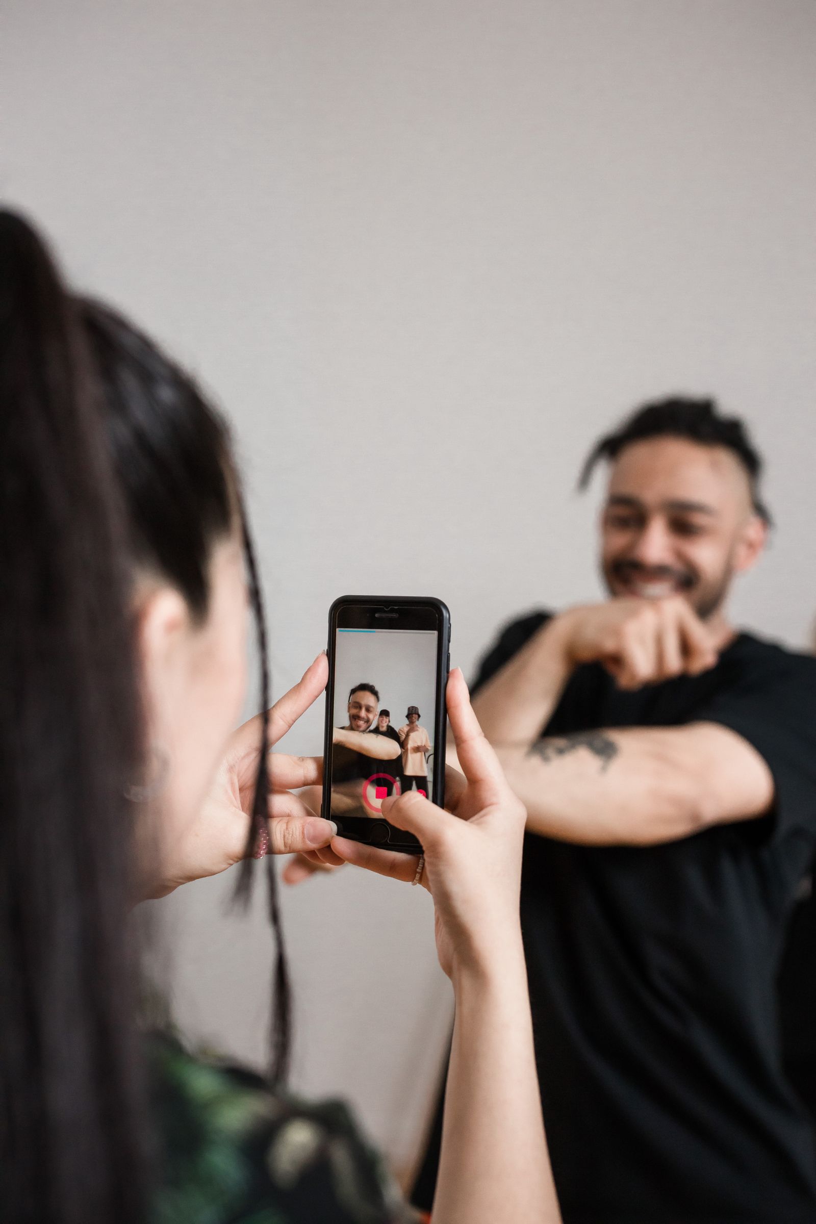 Person recording a video on a smartphone